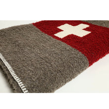 Load image into Gallery viewer, Brown and red throw with a white plus sign in the red stripefolded up on a white floor