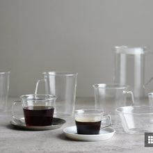 Load image into Gallery viewer, both the larger coffee cup with coffee in it and the expresso cup with expresso in it on a wooden tray on a countertop with other glassware behind them