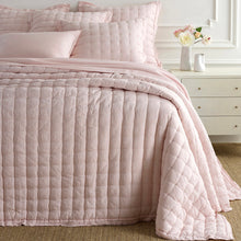 Load image into Gallery viewer, pink linen puff in a bedroom setting with a bedside table and flowers next to it