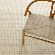 Load image into Gallery viewer, Natural rug with a rattan chair on top