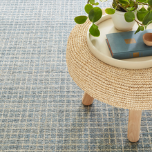 Load image into Gallery viewer, Slate rug with a woven stool and a plant on top