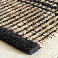 Load image into Gallery viewer, Corner of the camel rug on hardwood floors