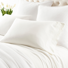 Load image into Gallery viewer, ivory sheets on a white bed setting