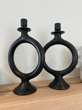 Load image into Gallery viewer, two black O candle sticks on a wooden shelf