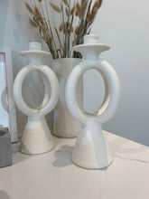 Load image into Gallery viewer, two double O candle holders with a white tall vase and pompous grass