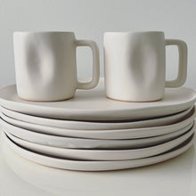 Load image into Gallery viewer, White ceramic Alex Marshall mugs on white dinner plates