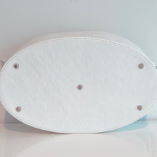 Load image into Gallery viewer, Bottom of the white tote on a white shelf