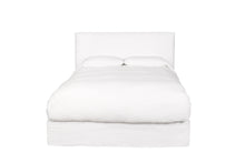 Load image into Gallery viewer, White bed in a white room with the white linen sheets and comforter