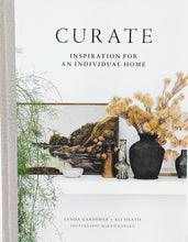 Load image into Gallery viewer, Front cover of book titled Curate, Cover has artwork, vases, vase with flowers, sitting on a mantle with green plant on side.