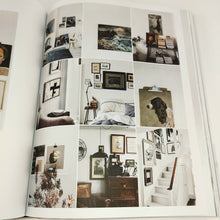 Load image into Gallery viewer, Curate Book open to a page with a grid of images of home decor art on walls, stairs, bed, bookshelf, etc.