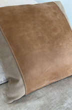 Load image into Gallery viewer, Size view of the tan and leather pillow on a tan couch
