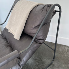 Load image into Gallery viewer, Side view of the grey black Brando chair with a cream throw on the back of the chair
