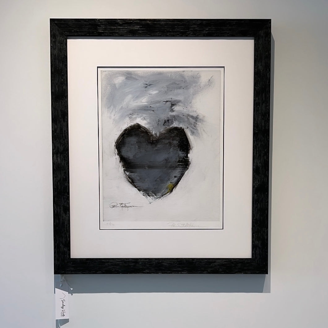 changing hearts print with a black frame and a white mat