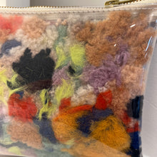 Load image into Gallery viewer, up close photo of the colorful pouch with a brass zipper 

