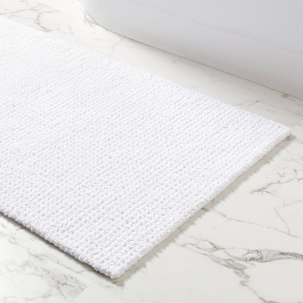 white rug on a marble floor
