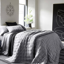 Load image into Gallery viewer, a different view of a bedroom scene with the grey linen puff
