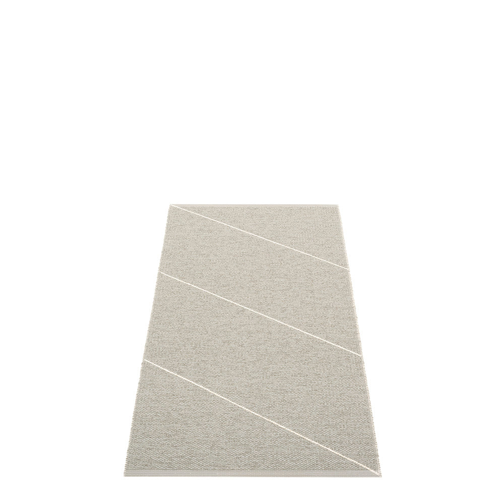 grey side of the rug with diagonal white stipes on a white floor 