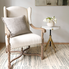 Load image into Gallery viewer, Stone square pillow on a white chair in an office scene 
