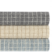 Load image into Gallery viewer, Stack of all three colored rugs. Grey on top, natural in the middle, and slate on bottom. 
