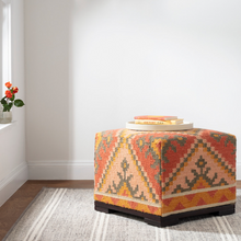 Load image into Gallery viewer, Grey rug with colorful square ottoman on top
