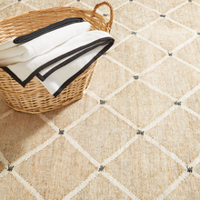 Load image into Gallery viewer, Natural rug with a laundry basket on top
