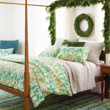 Load image into Gallery viewer, Plaster bed sheets on a wooden canopy bed with a green bed setting
