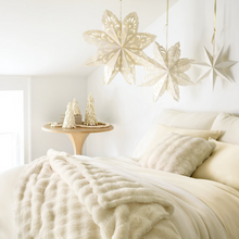 Load image into Gallery viewer, Fab Faux ivory pillow on a white and cream bed setting with white Christmas decor 
