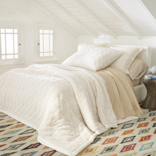 Load image into Gallery viewer, Ivory marshmallow fleece puff sham on a white bed setting
