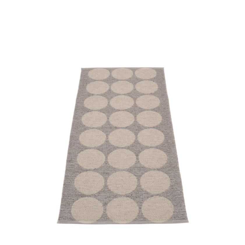 Mud metallic and mud colored rug with 8 rows of 3 dots on a white background