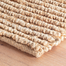 Load image into Gallery viewer, Corner of the natural rug on hardwood floors
