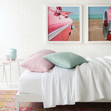 Load image into Gallery viewer, White quilt on a white bed setting with a pink room
