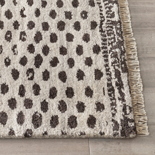 Load image into Gallery viewer, corner of the hand knotted hugo rug (hand knotted section) 
