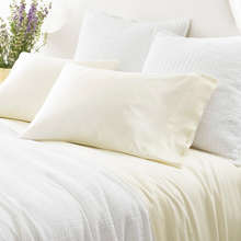 Load image into Gallery viewer, ivory pillow cases on a white bed setting
