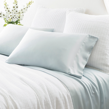 Load image into Gallery viewer, robin&#39;s egg blue sheets on a white bed setting
