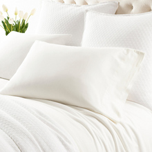 Load image into Gallery viewer, ivory sheets on a white bed setting
