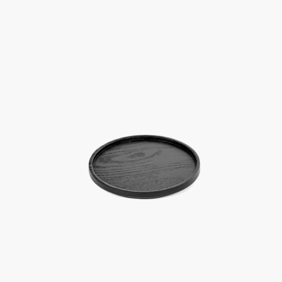 black coaster on a white background