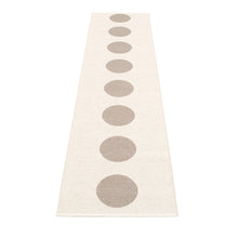 Load image into Gallery viewer, cream rug with 8 mud dots in the center on a white floor
