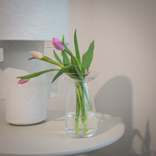Load image into Gallery viewer, clear kinto glass vase with tulips in the vase next to a lamp

