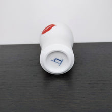 Load image into Gallery viewer, bottom of the kiss cup on the black shelf
