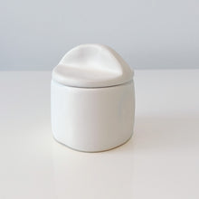 Load image into Gallery viewer, Close up of the white sugar bowl with the lid on a white shelf
