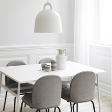 Load image into Gallery viewer, White Normann Copenhagen bell light in a dining room setting with a white table and grey chairs 
