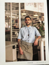 Load image into Gallery viewer, Man with an apron posing on a table 
