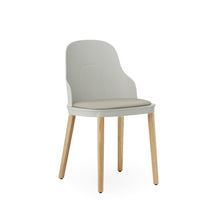 Load image into Gallery viewer, View from front angle of Normann Copenhagen Allez Chair lite grey with leather seat and oak legs,
