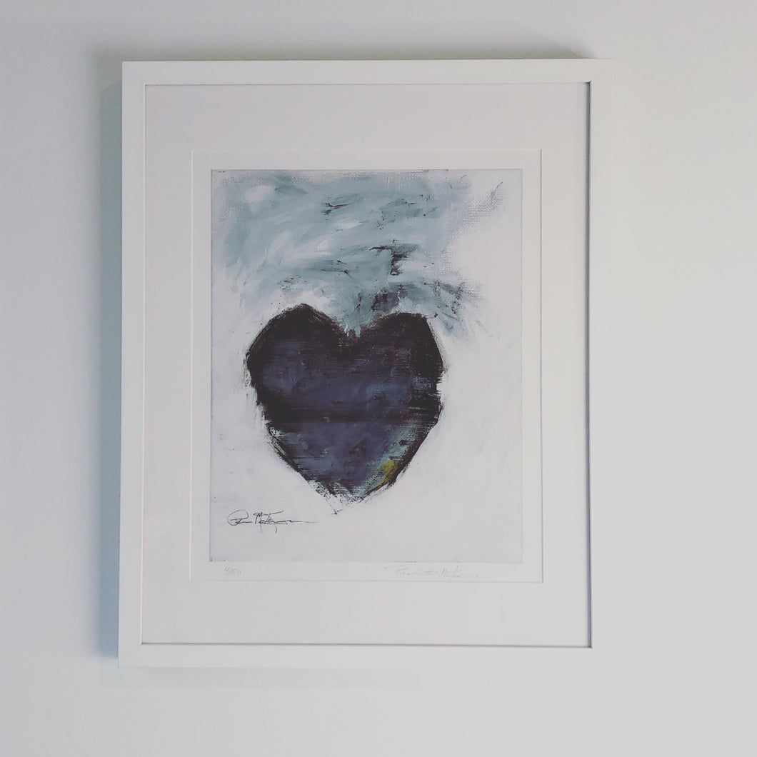 Print of a black heart on a white and grey background. Framed in a white frame and laid on a white mat