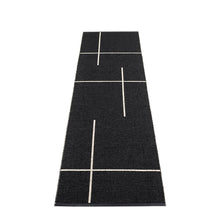 Load image into Gallery viewer, Black rug with white geometric lines laid on a white floor
