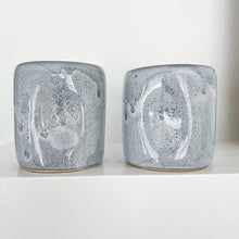 Load image into Gallery viewer, Speckled blue Alex Marshall tumbler on a white shelf
