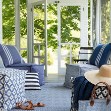 Load image into Gallery viewer, sitting area with different designed blue puffs
