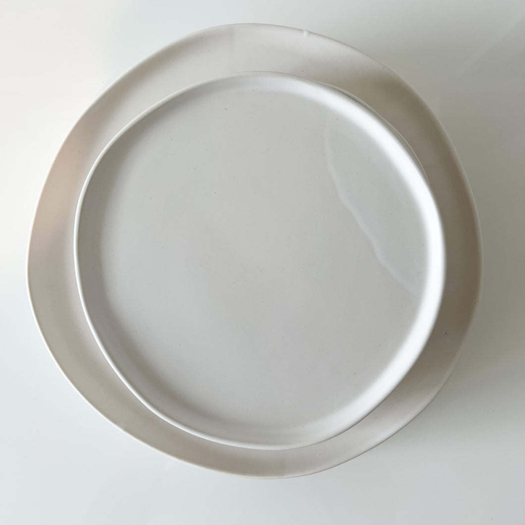 two sized urban plates on a white counter