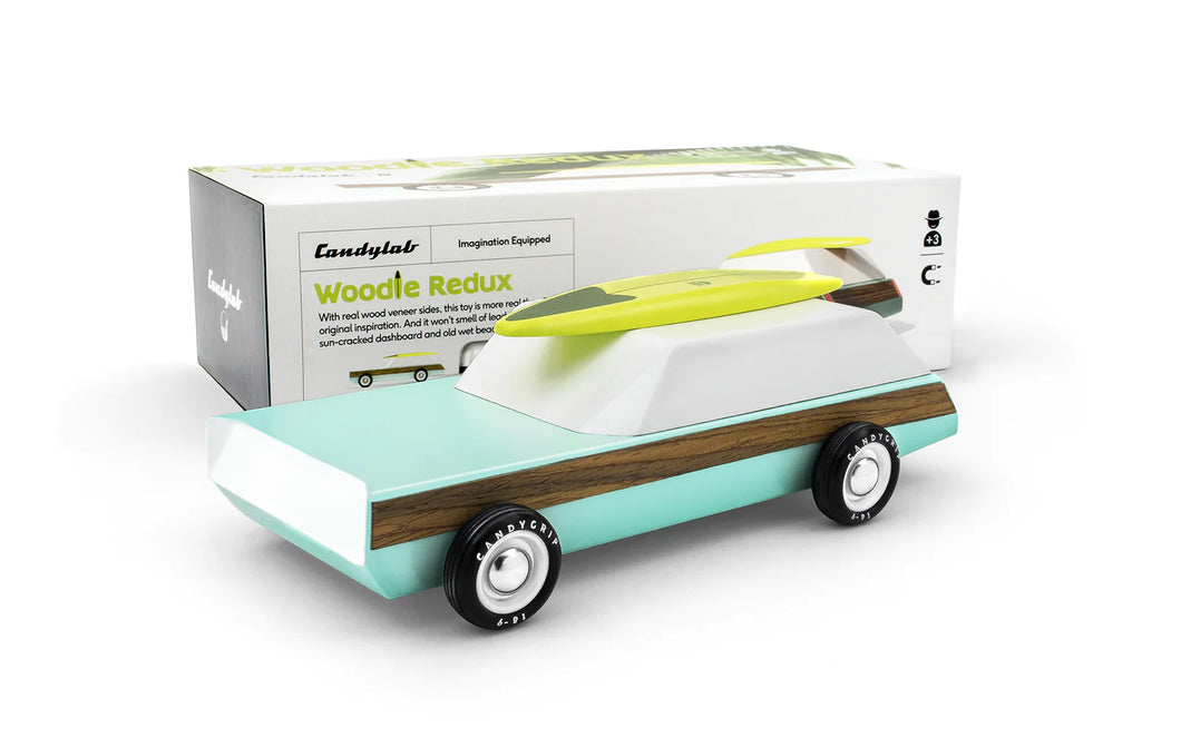 green and wood wagon on a white background with the box