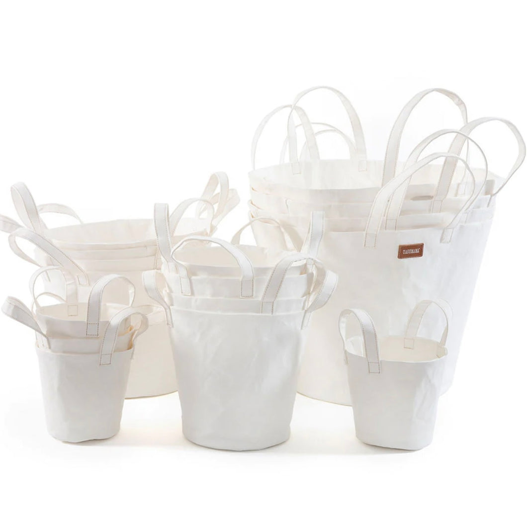 stacked of different sized buckets in a white area